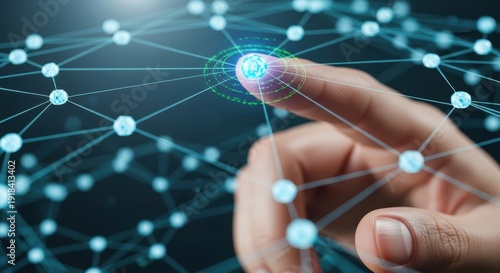 Close up of fingertips touching a node on a digital network mesh that lights up to signify connectivity and AI integration.