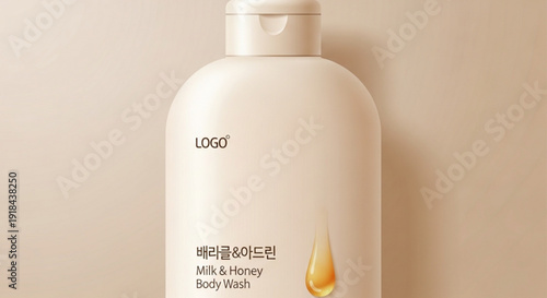 Milk and honey body wash bottle on beige background with golden drop