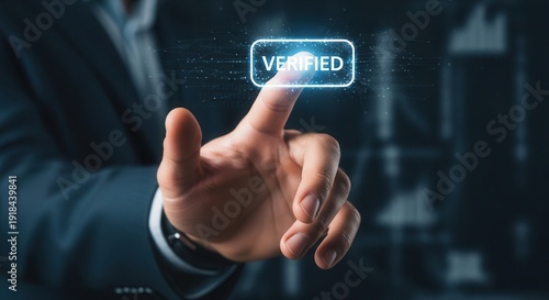 Businessman hand pressing a virtual verified badge to establish authenticity and build digital trust.