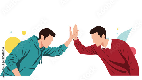 Two young men enthusiastically giving each other a high-five, symbolizing successful collaboration, achievement, or a friendly greeting.