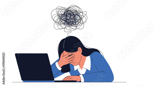 Overwhelmed woman holding her head in her hands, looking distressed at a laptop, symbolizing mental burnout and stress.