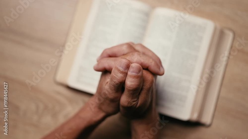 Wallpaper Mural Old man hands clasped prayer with Holy Bible for Christian faith, spirituality, worship, devotion, hope, and religious belief, prayer time in church, trust in God, and spiritual guidance. Torontodigital.ca
