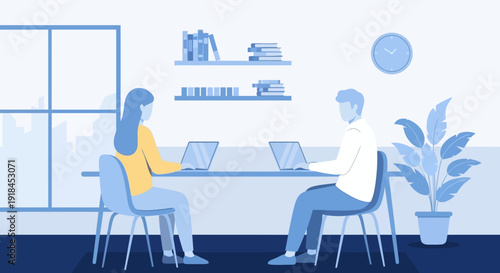 Two colleagues working together on laptops in a modern office environment viewed from the side