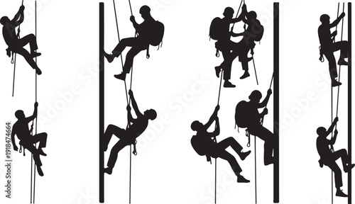 Silhouettes of people rock climbing and rappelling down ropes