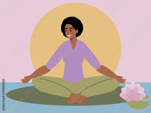 Young woman of African descent sitting crossed-legged outdoors at dawn in Sukhasana yoga easy pose