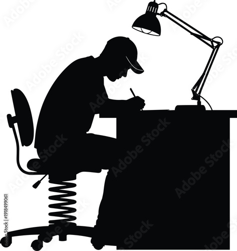 Black vector silhouette of a focused student or designer wearing a cap, intensely concentrating and writing or drawing at a desk under the bright illumination of an adjustable task lamp, 