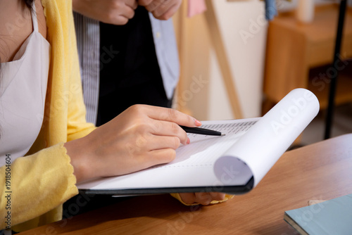 Wallpaper Mural Close up two asian woman working and check document while managing and planning online business and checking order, entrepreneur and small business, retail with online seller, startup business. Torontodigital.ca