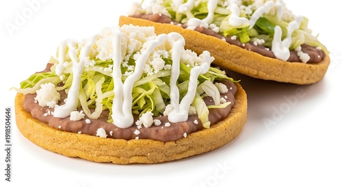 Authentic Mexican Sopes with Crema, Beans, and Cotija, Isolated.
