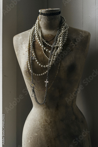 Vintage Dress Form with Layered Pearl Necklaces and Cross Pendant