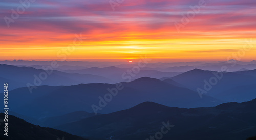 Wallpaper Mural A serene mountain landscape at sunset with vibrant colors in the sky. Torontodigital.ca