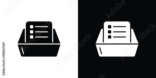 A black and white illustration of a document in a tray on a contrasting background
