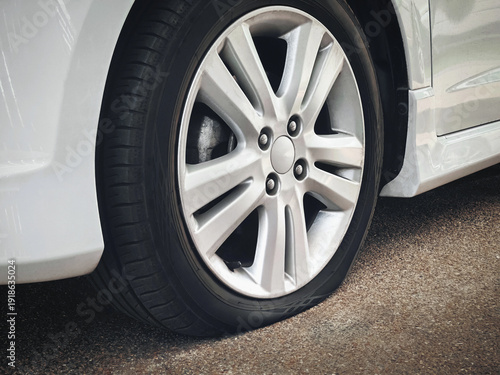 Wallpaper Mural Flat car tire, punctured rubber wheel accident and breakdown concept Torontodigital.ca