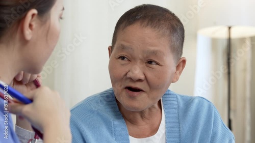 Female, nurse and tablet with senior patient for living assistance or healthcare in retirement home. Female, caregiver and listening to client with technology for elderly care in old age house.