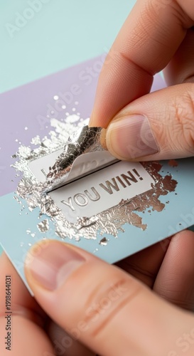 Person scraping off lottery ticket.