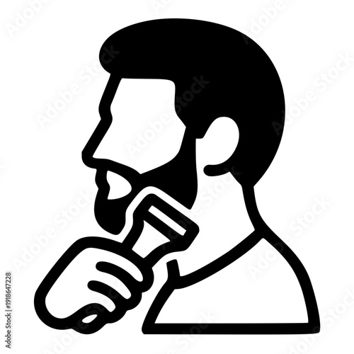 Man shaving with electric razor in modern grooming routine