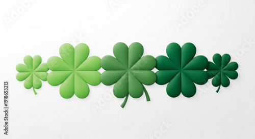 Green four leaf clovers in a row on white background for luck and st patrick's day