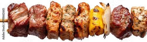 Grilled skewer featuring various meats, pepper, and onion, on a wooden stick