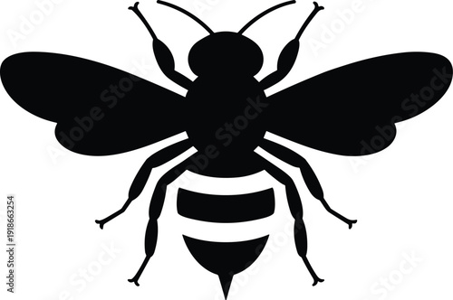 Black silhouette of a bee in flight with outstretched wings