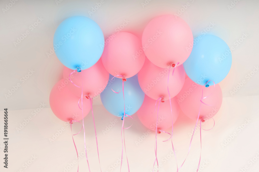 Fototapeta premium Pink and blue balloons hang, festive vibe, isolated on white, PNG