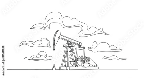 Oil pump jack working under cloudy sky