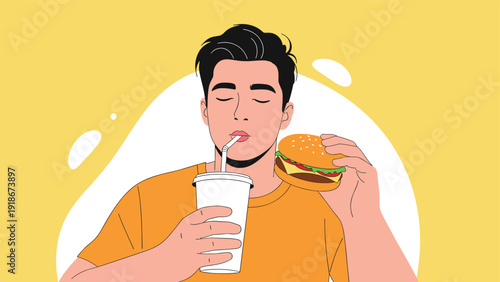 Close up of a young man with his eyes closed enjoying a tasty hamburger and a refreshing drink with a straw against a warm yellow background.