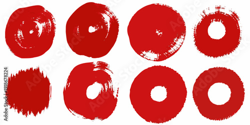 Abstract red brushstrokes forming circular and amorphous shapes on white