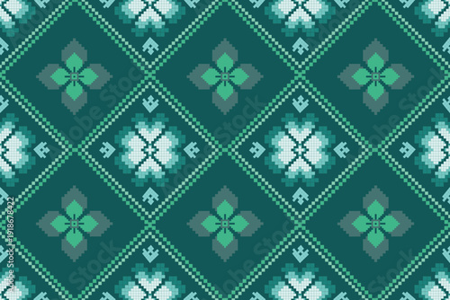 Geometric graphic pattern in green tones featuring diamond shapes with floral motifs inside. The pixel-style elements are layered evenly in a seamless repeating design.