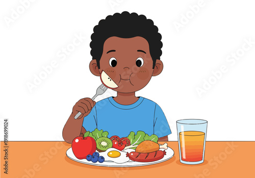 A happy young Black boy with curly hair eating a healthy meal with fruits, vegetables, egg, and sausage, along with a glass of orange juice.