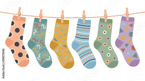 Colorful patterned socks drying on a clothesline, laundry day concept