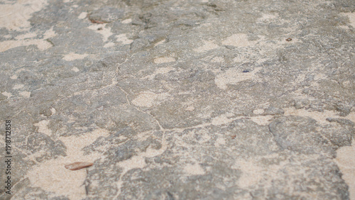 Quadro em tela Aerial view of rocky terrain with weathered stone surface and scattered debris