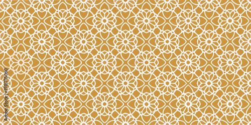 Intricate floral pattern with repeating white designs on a golden background