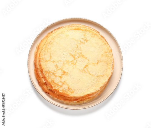 Plate with tasty thin pancakes on white background