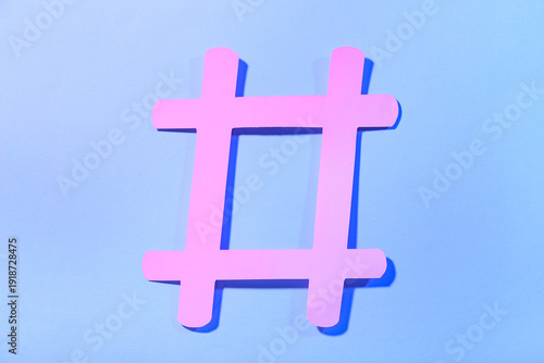 Hashtag made of paper on bl...
