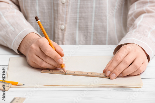 Young woman with ruler, pen...