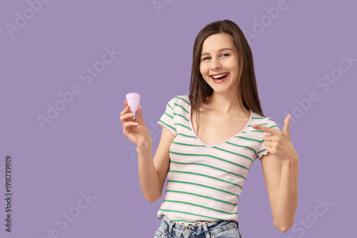 Happy young woman pointing ...