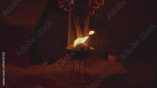 Woman. Female hands. Fire show. Sand. Bowl of fire. Slow motion video. High quality 4k footage
