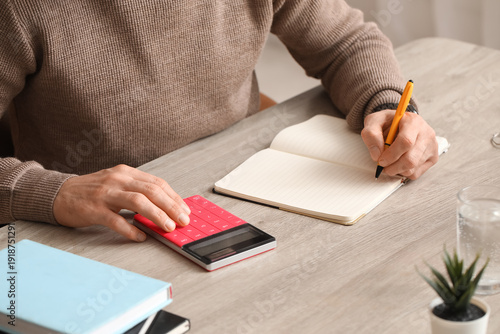 Man writing something and u...