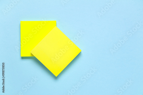 Blank sticky notes on blue ...