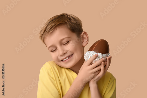 Smiling little boy with cho...