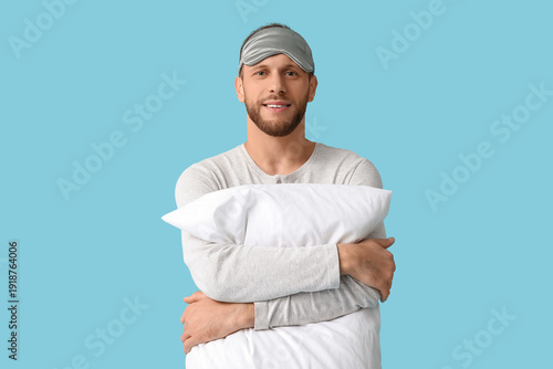 Young man in pajamas with s...
