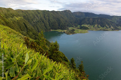 A beautiful view of a lake with mountains in the background at Sete Cidades, Azores.