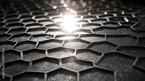 光が反射する黒いハニカム構造の抽象的テクスチャ - テクノロジー、ナノ技術、軽量素材、未来的なグリッドデザイン背景