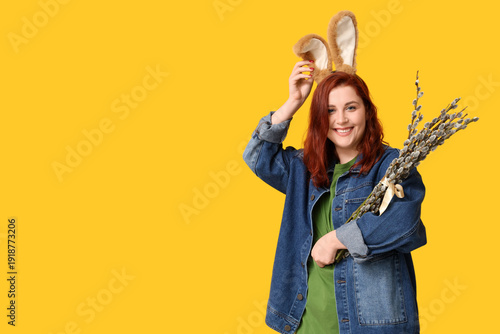 Happy young woman in bunny ...