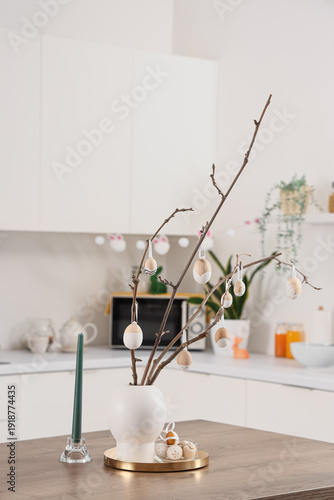 Vase with tree branches and...