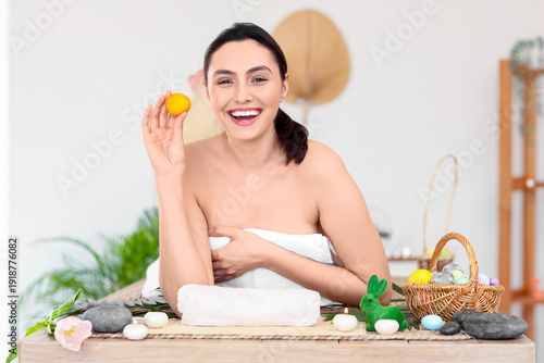 Young woman with Easter egg...