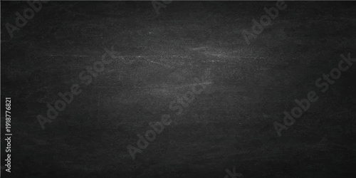 A vintage dark gray grunge texture captures the rough surface of an old blank blackboard set within a dirty frame as a textured concrete wall backdrop for design