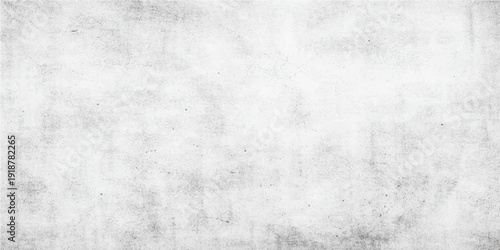 A dark aged vintage paper texture with a dirty grunge pattern and a rough grey concrete surface backdrop for a blank textured design