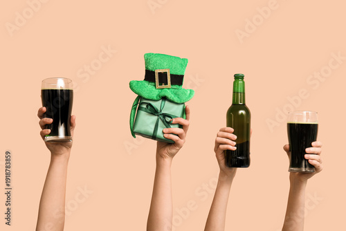 Hands with beer, gift and p...