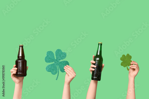 Hands with beer and clover ...