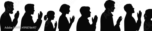 Silhouettes of people with hands raised black white background